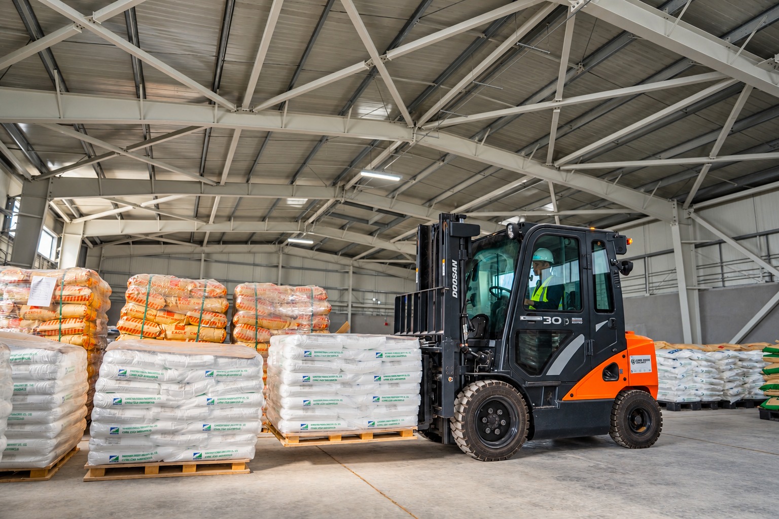 Forklift carrying palletized cargo inside a warehouse
